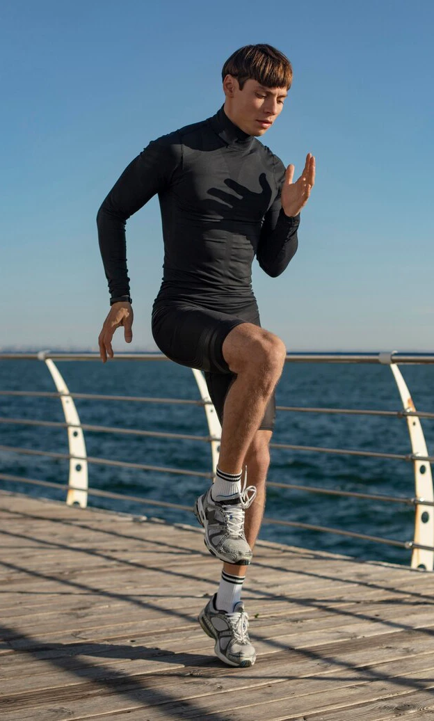 man-beach-working-out-activewear_23-2148773838